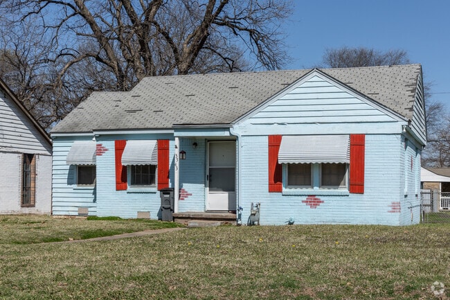 Bright colors and red shutters on this home increase the colorful vibes of Sequoyah.