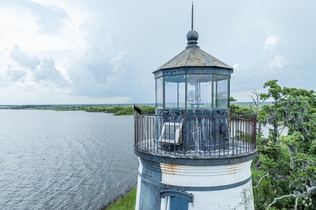 The Tchefuncte Lighthouse stands as a timeless symbol of Madisonville, guiding vessels and honoring the town’s maritime roots.