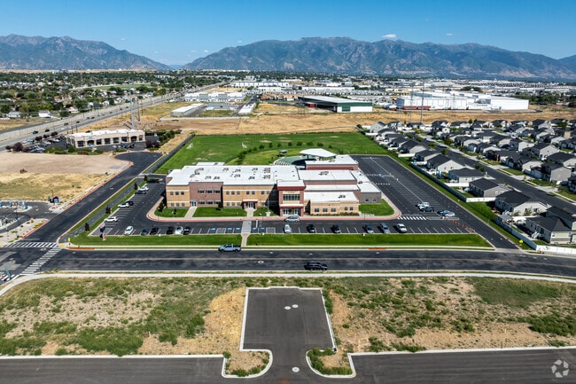 Brick pillars mark the entrance to Syracuse Arts Academy.