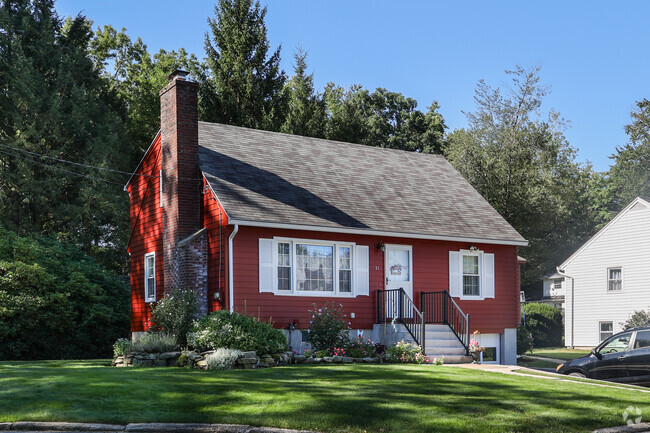 This classic Cape Cod home is nestled in Green Acres.