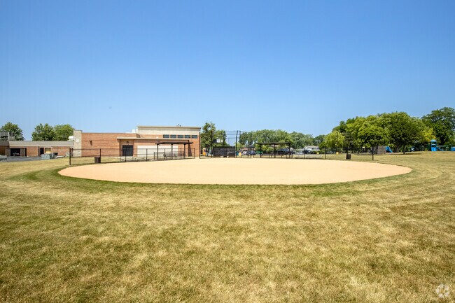 A baseball field is found in the open space at Admiral Byrd Elementary School.