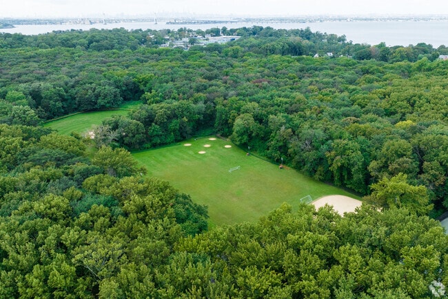 In the middle of Kings Point Park is a clearing for tennis courts and  softball fields.