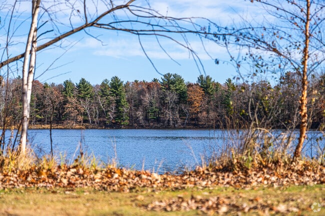The Wisconsin River glistens under clear skies, inviting boating, fishing, and more.