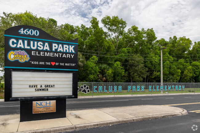 Calusa Park Elementary School in Naples welcomes students with a large sign and school pride.
