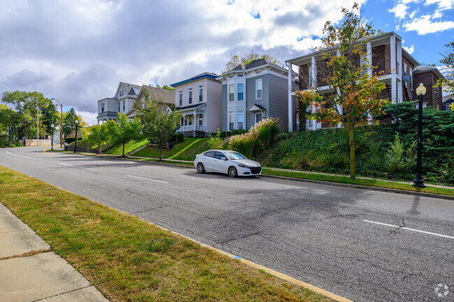 A row of Victorian-era homes line a hill in the Perrin neighborhood.