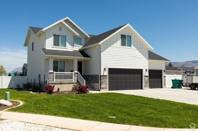 A white home in West Haven stands elegantly amidst the neighborhood, with its pristine exterior and charming architectural details.