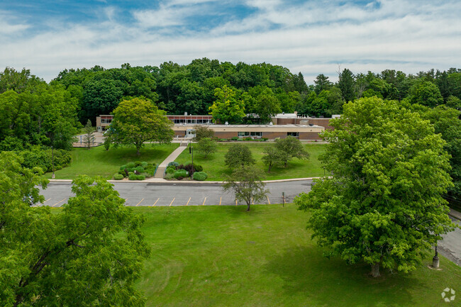 Cayuga Heights Elementary is in a wooded, rural setting.