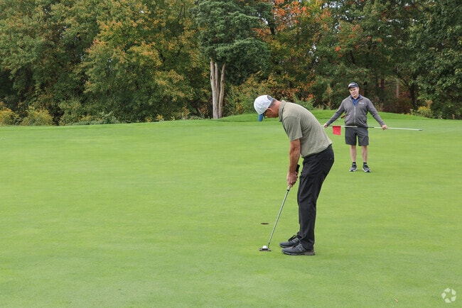 Golfers from The Point spend leisurely days on the lush fairways of the nearby Olde Salem Greens Golf Course, enjoying both challenge and charm in every swing.