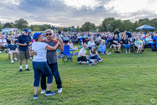 A couple dances at the Footloose on the Neuse concert in downtown New Bern, a popular destination for summer concert series for residents of Havelock's Cherry Branch neighborhood.