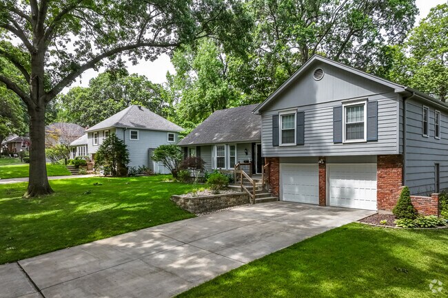 2 car garages with wide driveways on hillsides live here in the Red Bridge South neighborhood.