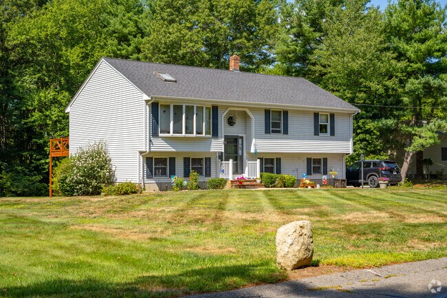 Split‑levels line wooded streets near Massasoit State Park.