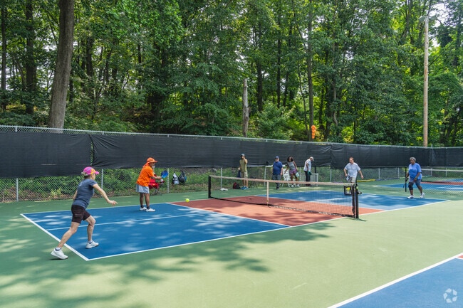 Residents of Pennsauken gather at the River Road Pickleball Complex for friendly matches.