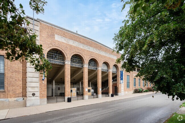 There is a football stadium behind the Middle Early College High School in Buffalo.