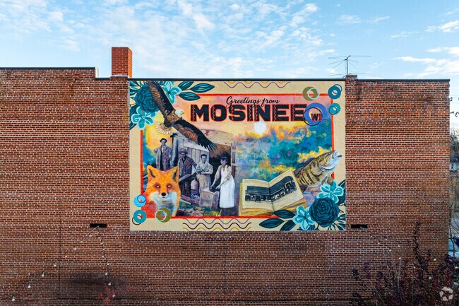 A colorful mural welcomes visitors to Mosinee.