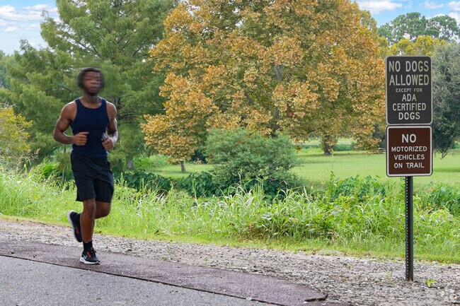 Tranquil Lake Mayer Park offers paved paths for leisurely walks and runs in Highland Park.