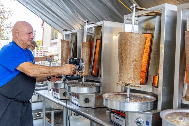 Meat is cooked and cut at the Woburn GyroFest for a taste of Greece in downtown Woburn, MA