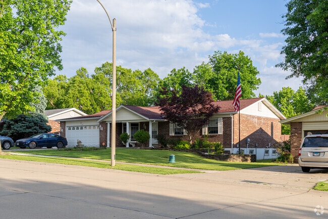 Well kept trees and bushes line the front of homes along the streets of Bridgeton.