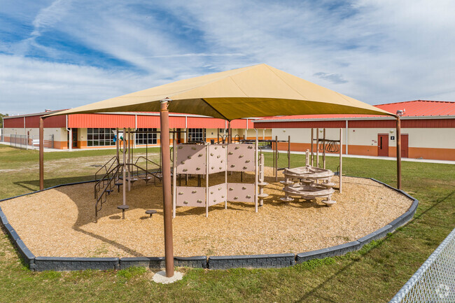 Kids enjoy playing on the play area at New River Elementary.