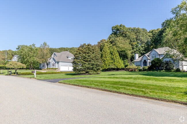 Homes in Outer Tiverton feature large parcels with trees, offering privacy and space.