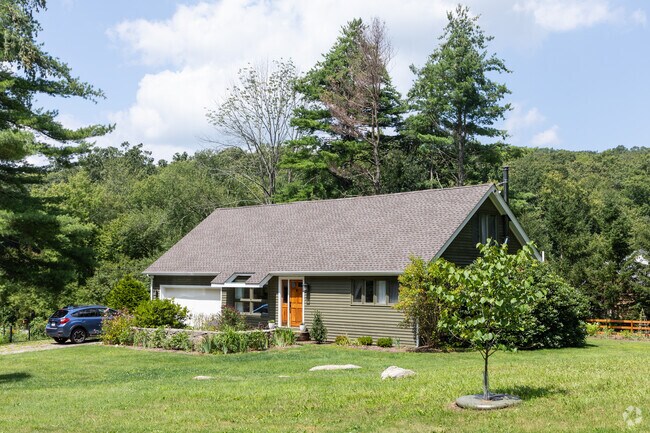 Nestled in Pound Ridge, the ranch style house exudes warmth and homey elegance.
