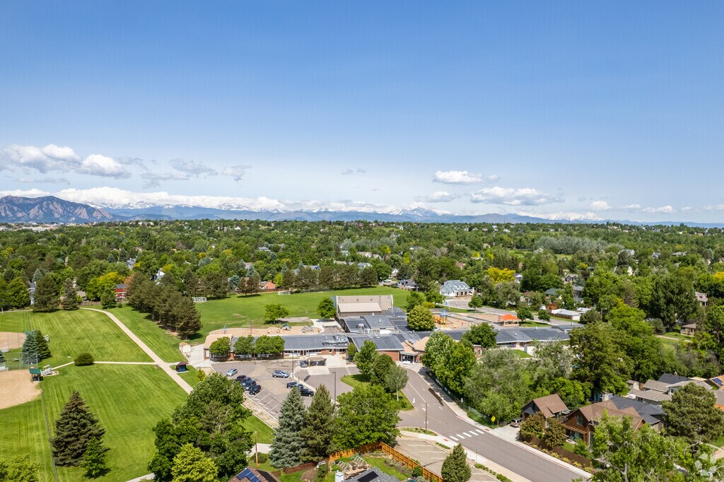 An aerial view showing the campus, homes and nearby park at Louisville Elementary School.