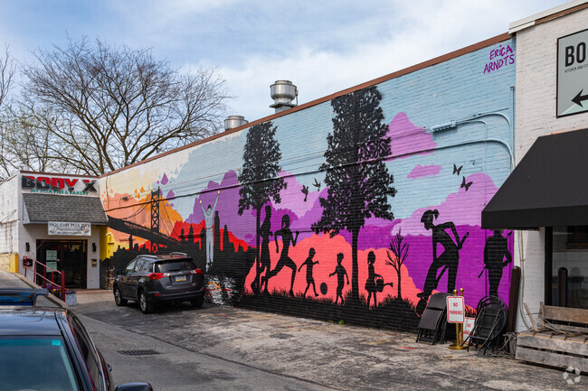 Murals cover the sides of many urban storefronts in the Bryn Mawr neighborhood.
