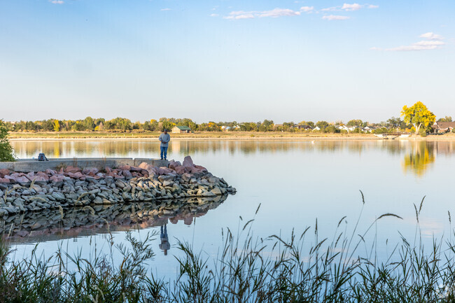The lake next to Downtown Windsor draws afternoon fishermen.