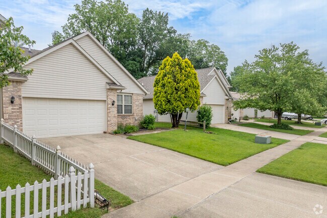 Residential streets in Mahomet can be characterized by large trees and paved sidewalks.