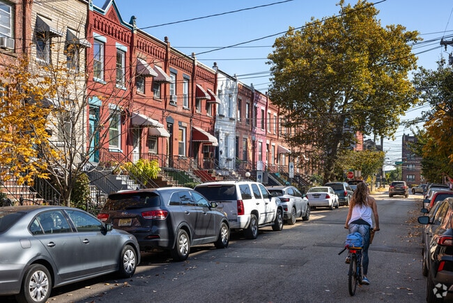 Rows of red brick and brownstone homes in Jersey City are prominent and often renovated.