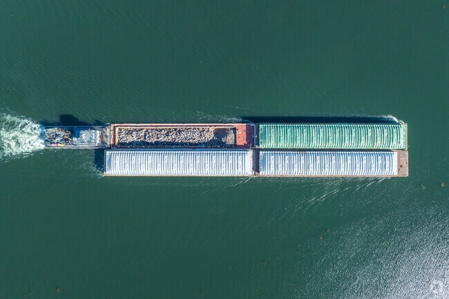 You'll get used to seeing cargo boats traveling next to Wheeling Island along the Ohio River.