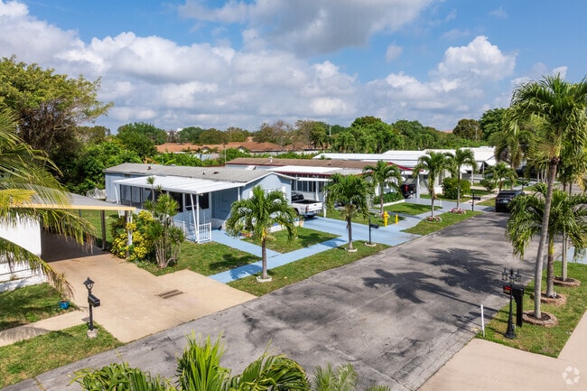 Embrace the cozy ambiance of the row of mobile homes at Highland Meadows!