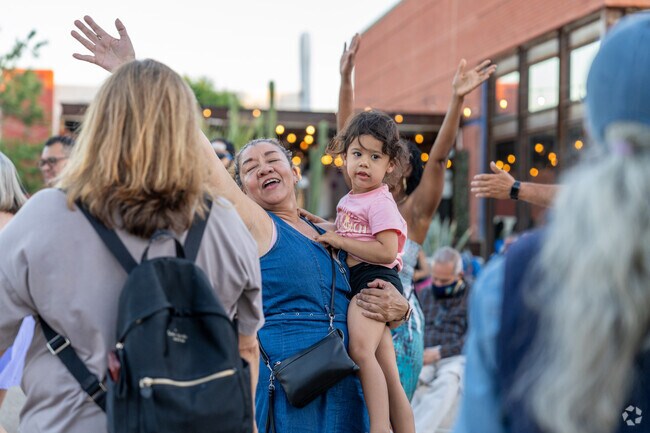 People young and old people enjoy themselves on the Summer Concert Series dance floor.