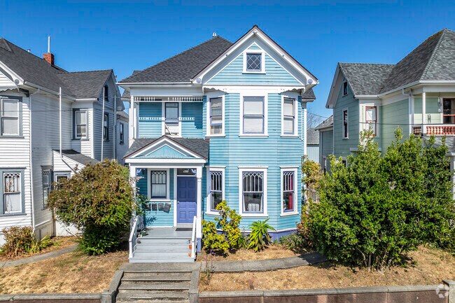 This Victorian home has the typical front porch and dormer window in Broadway Street.