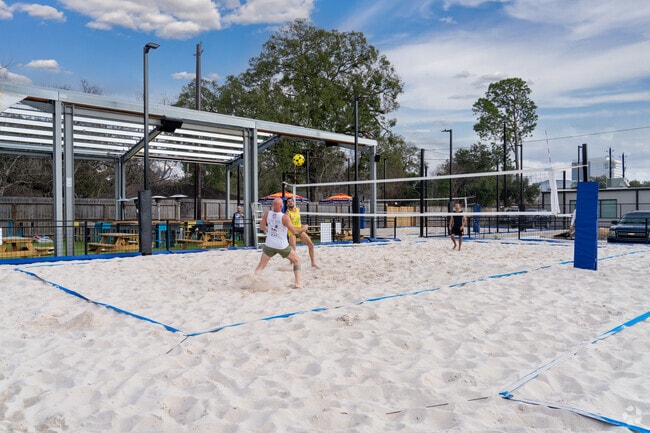 Spring Branch West locals engage in friendly competition on Decoy's sandy court.