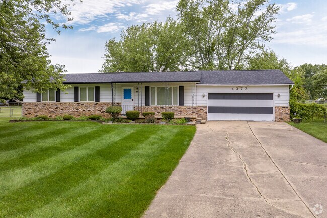 Ranch homes with manicured lawns line the streets of Burton.