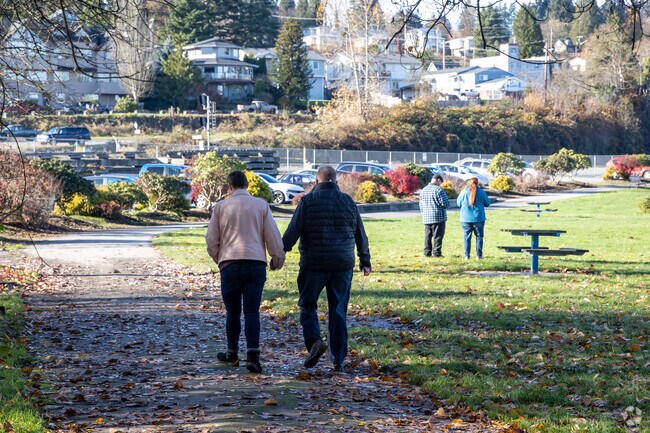 Valley View folks walk hand-in-hand at Rotary Park.
