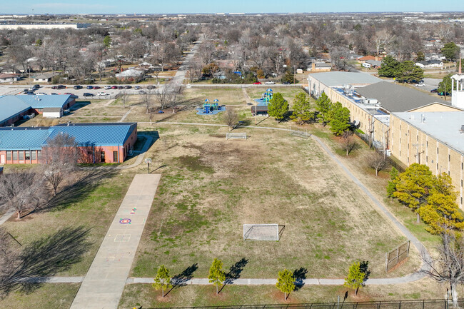 Lindbergh Elementary School has large open fields and multiple playgrounds for kids to play.