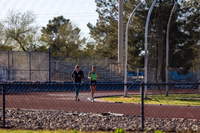 UArizona athletes run at Murphey Field at Mulcahy stadium.