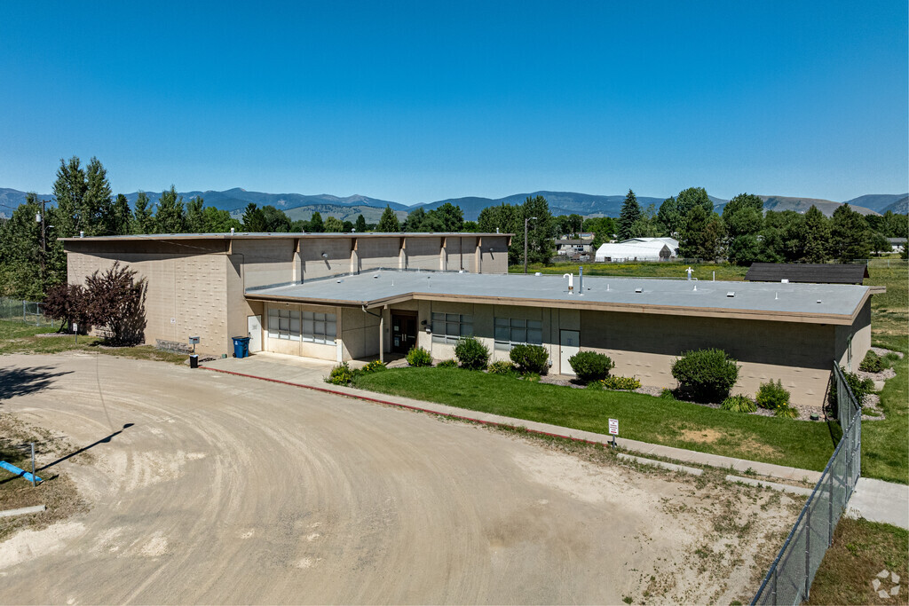 Try not to kick up dust at the dirt road in front of Mountain View Elementary School.