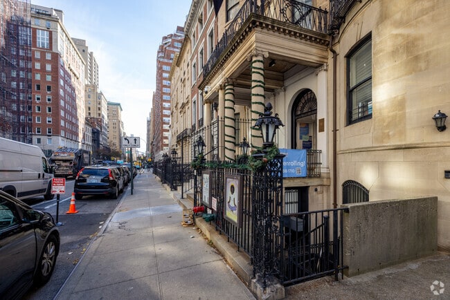 Academy of Thought and Industry at Museum Mile's staff gives attention to their students.