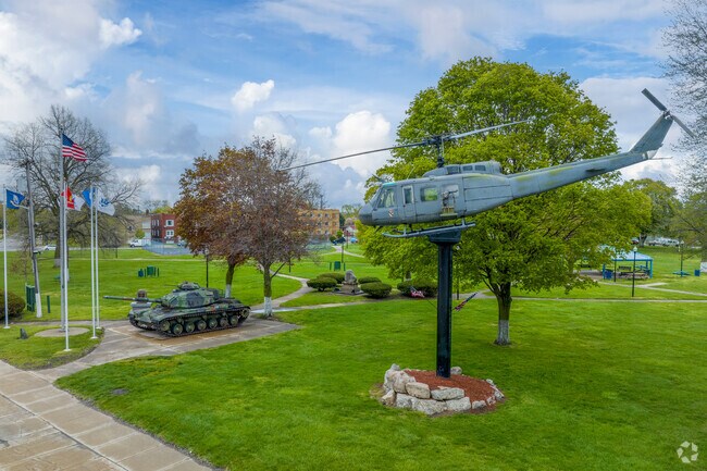 The monuments in 
River Rouge at Memorial Park are surrounded by walking paths and greenery.