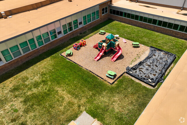 Lindemann Elementary School
has a fenced in playground for the children during recess.