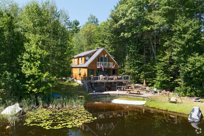 Perched on a quiet wooded lot, this home enjoys a prime location just off the peaceful shore of Sunrise Lake in Middleton.
