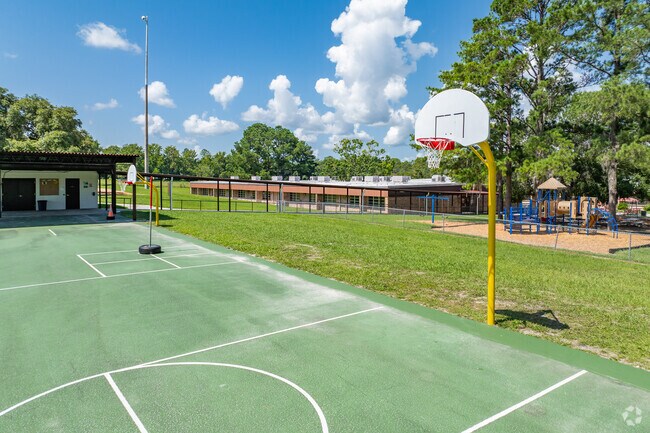 Students enjoy outdoor play on the sports courts at Pleasant Grove Elementary School.
