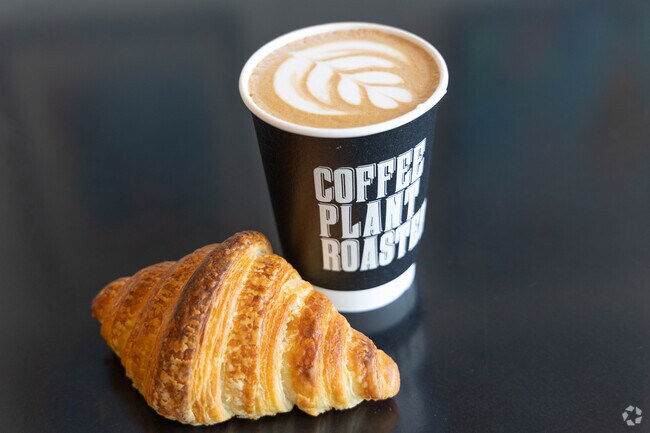 A coffee and pastry at Coffee Plant Roaster.