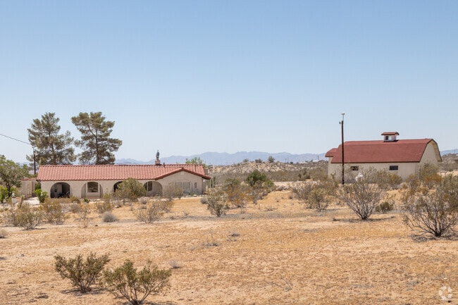 Classic Spanish style home seen in the desert landscape of Landers.