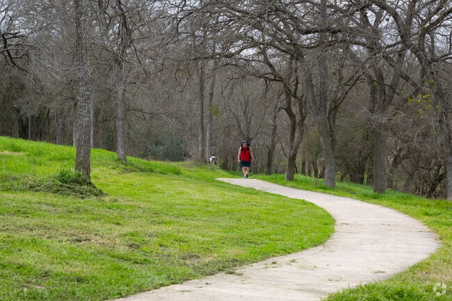 A backpacker putting on some miles on the trails of Veteran's Park in Universal City.