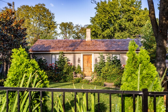 A cozy Cape Cod home with lush landscaping in the Historic Western Suburb