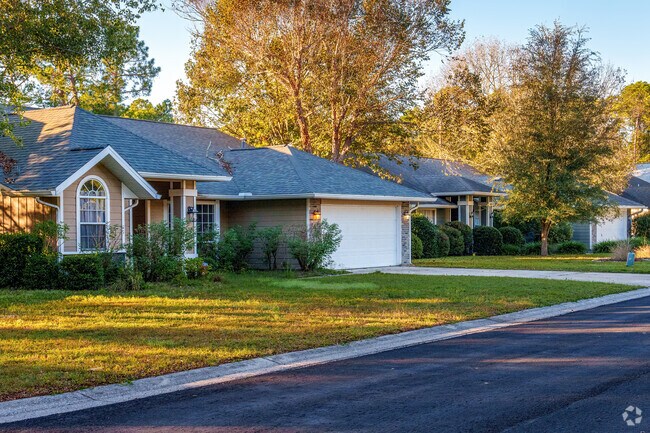 Mature trees provide shade and privacy to this row of homes in Sutter's Landing.