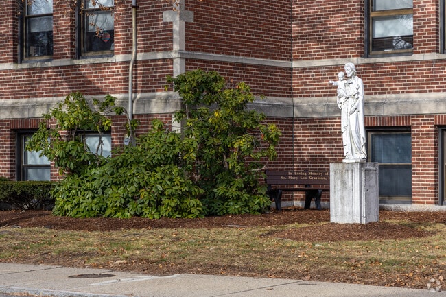 A statue in front of the St Joseph School in Wakefield, MA.